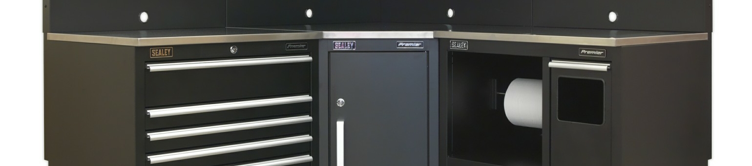 The corner of a Sealey Premier set of modular cabinets in black with stainless steel worktop.
