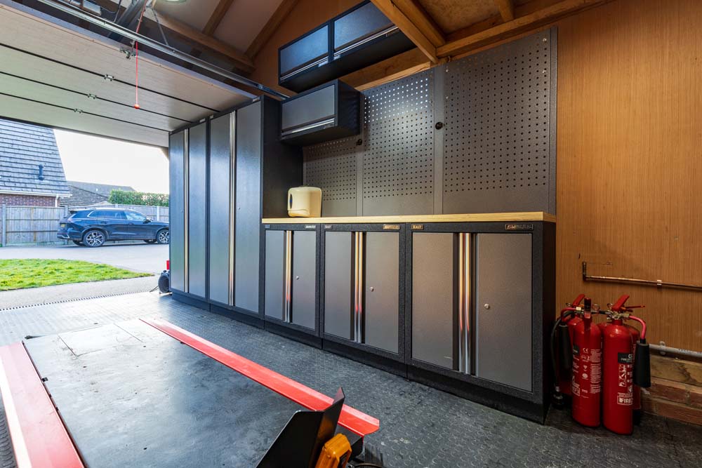 floor of garage with cabinets 